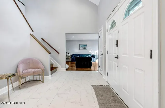 a view of a livingroom with a staircase
