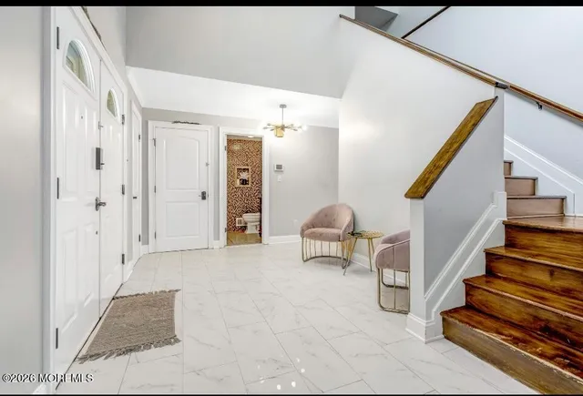 a view of entryway with stairs and furniture