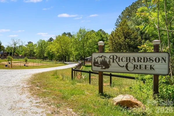 a view of a park with welcome board