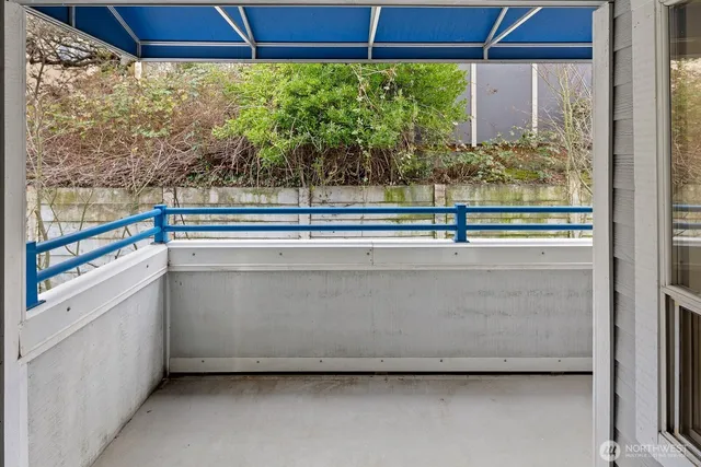 a view of a room with a kitchen