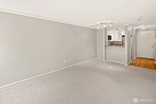 a view of an empty room with a window