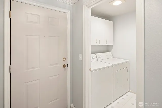 a kitchen with granite countertop a sink stove and refrigerator
