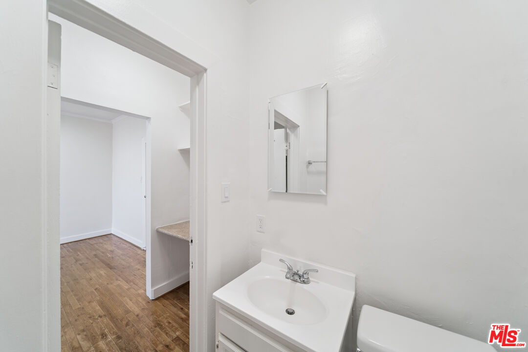 1267 Vin Scully Avenue, Unit 24 Los Angeles, CA 90026 - Photo 9 of 9 a bathroom with a sink and mirror