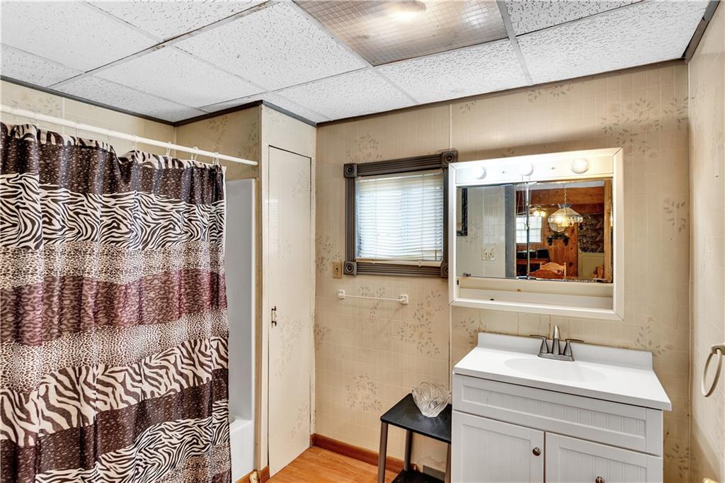 6808 Low Street Mount Pleasant, PA 15666 - Photo 15 of 28 Located on the first floor, this full bath is equipped with both a tub and shower.