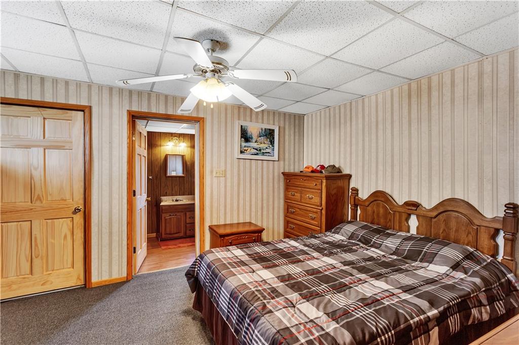 6808 Low Street Mount Pleasant, PA 15666 - Photo 20 of 28 Located on the 1st floor, this bedroom with a full-bath (tub only) is located just off the living room.