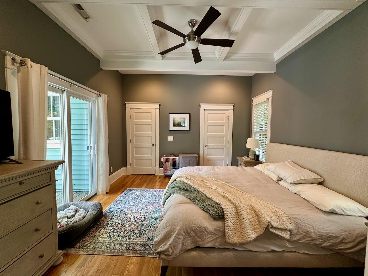 605 Elm Street Raleigh, NC 27604 - Photo 13 of 23 a bedroom with a bed and dresser with mirror