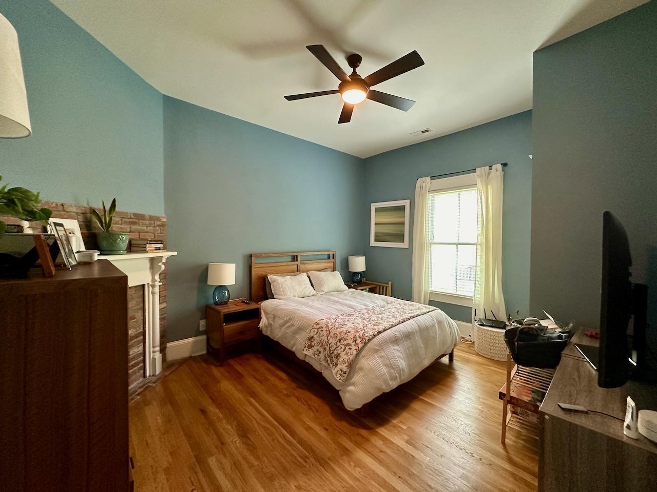 605 Elm Street Raleigh, NC 27604 - Photo 17 of 23 a bedroom with a bed and a flat screen tv