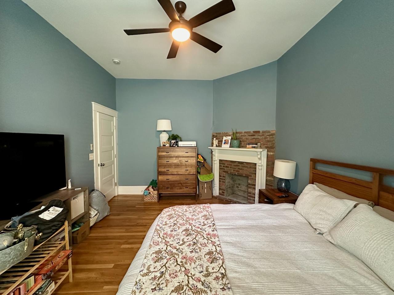 605 Elm Street Raleigh, NC 27604 - Photo 18 of 23 a bedroom with a bed and a flat screen tv