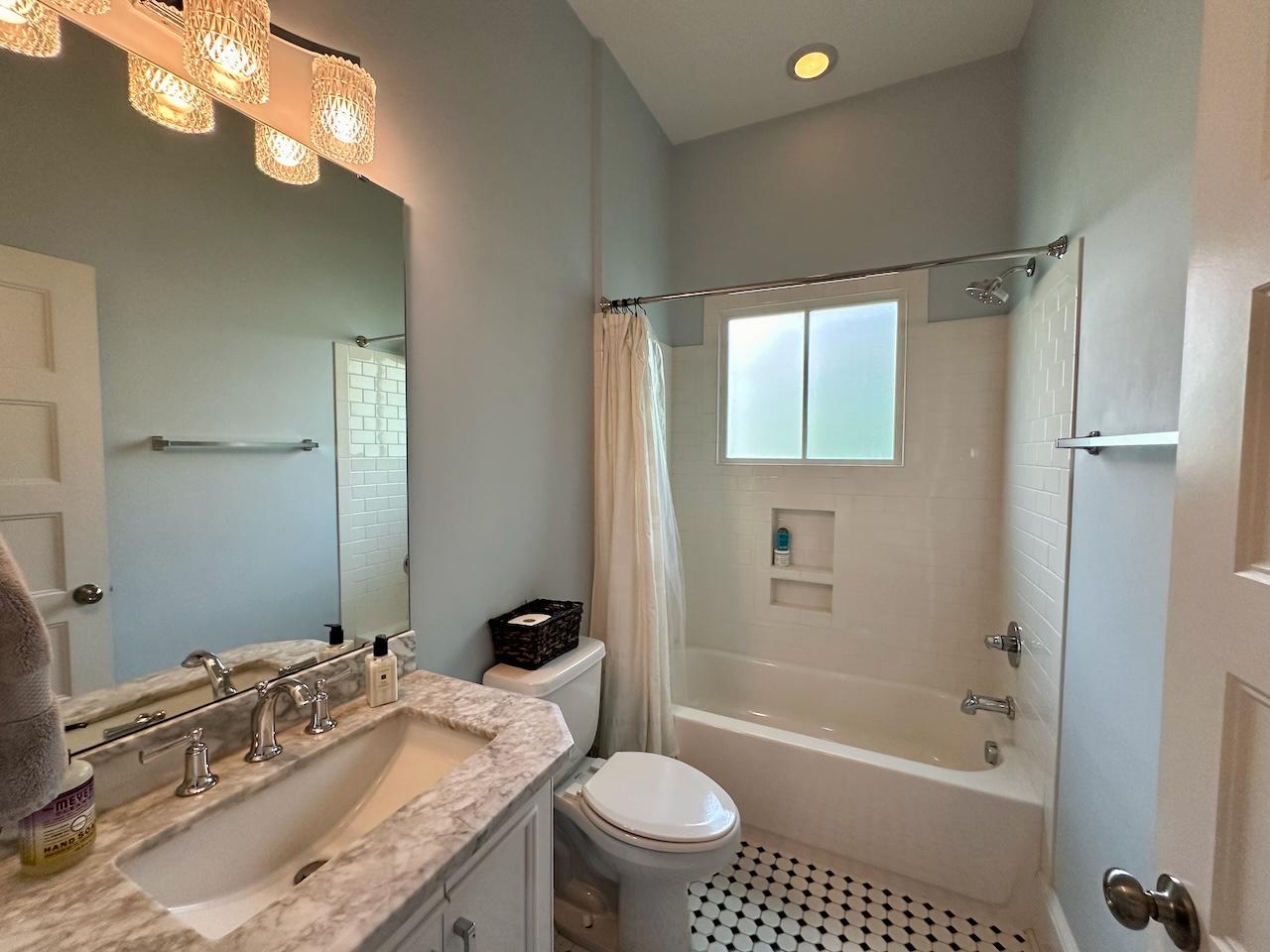 605 Elm Street Raleigh, NC 27604 - Photo 19 of 23 a bathroom with a granite countertop sink a toilet and shower