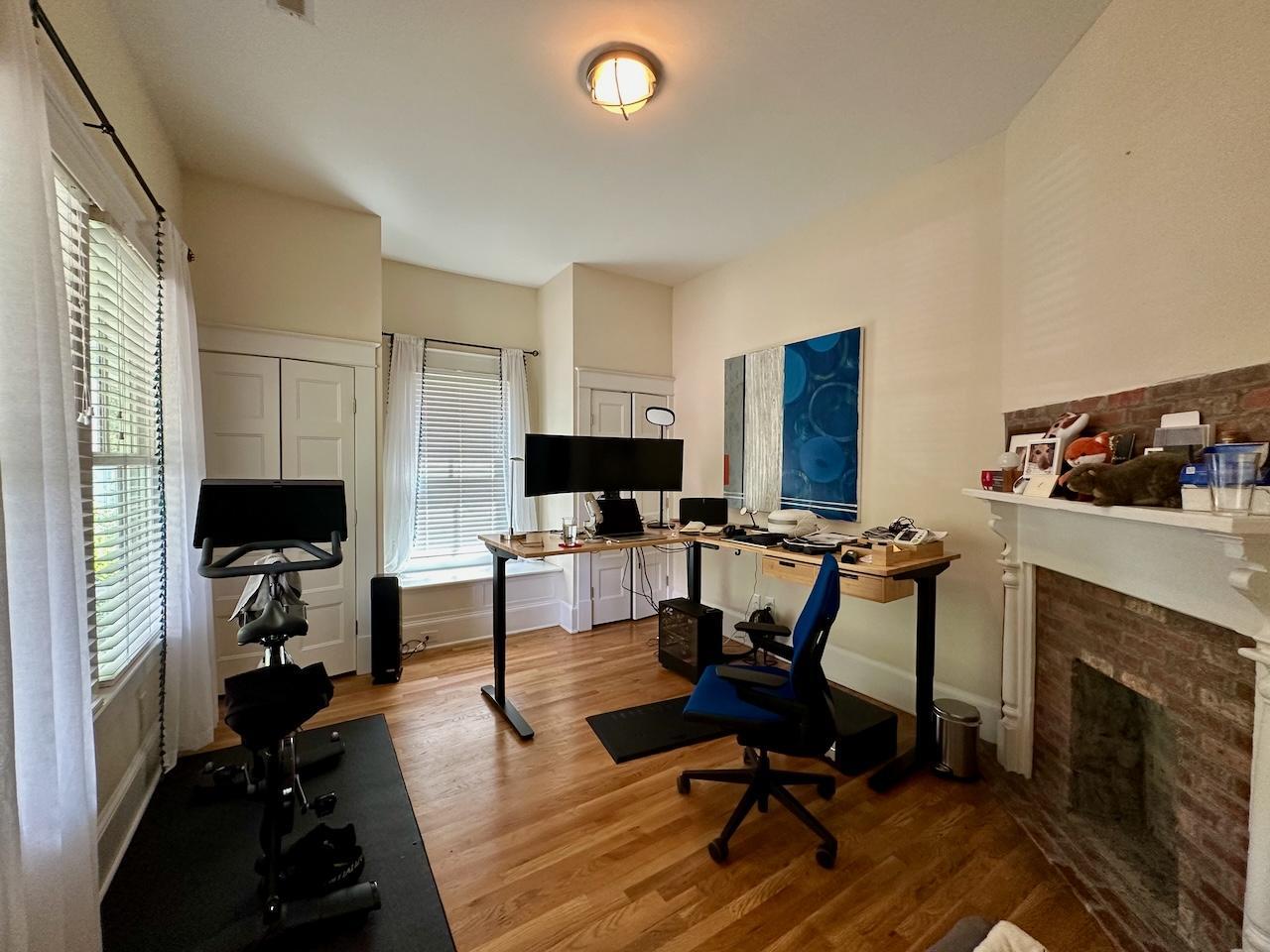 605 Elm Street Raleigh, NC 27604 - Photo 20 of 23 a view of a livingroom with workspace and a couch