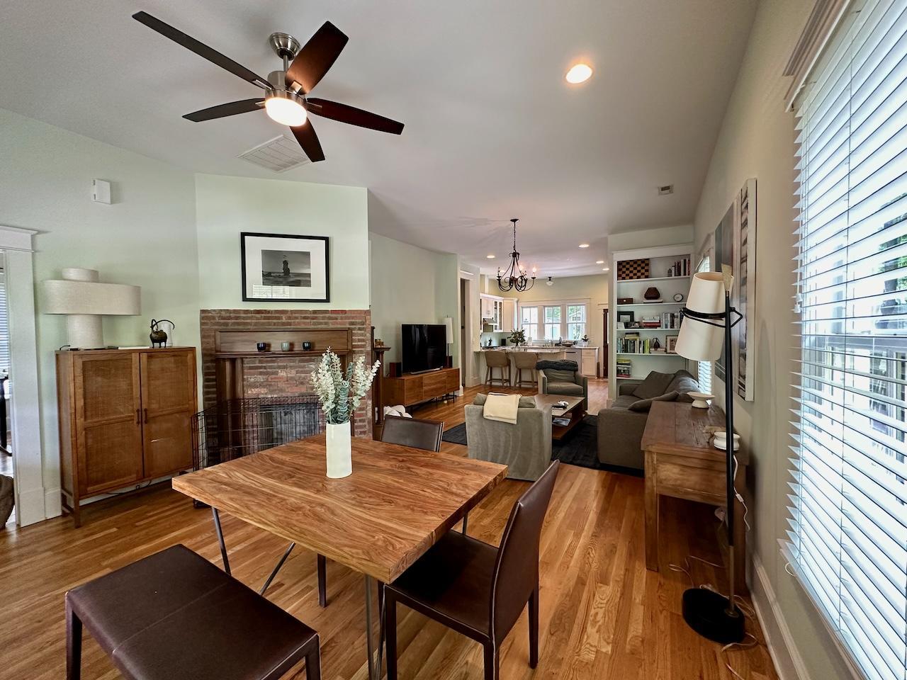 605 Elm Street Raleigh, NC 27604 - Photo 5 of 23 a living room with stainless steel appliances furniture a rug and a large window