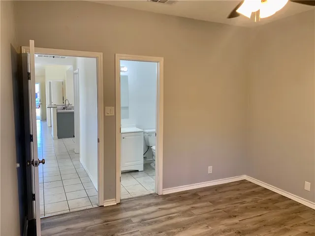 a view of a bathroom from a hallway