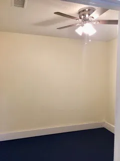 a view of a small space with wooden floor