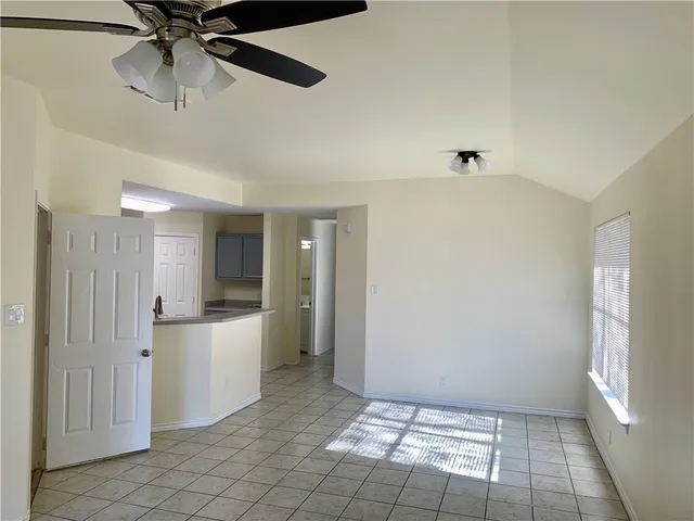 a view of a kitchen with a sink and cabinets