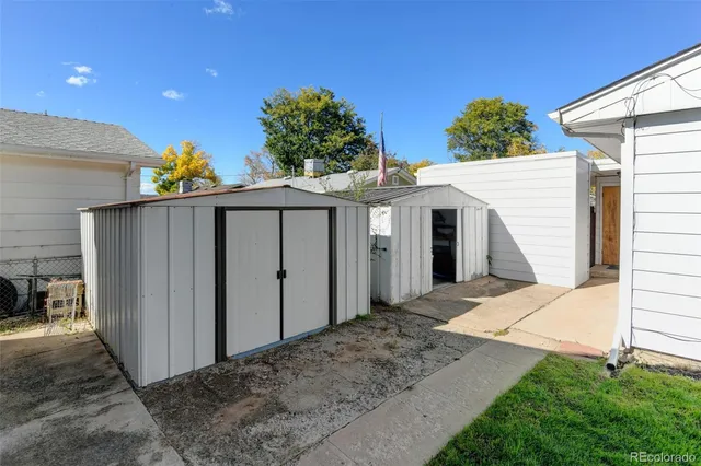 a view of a garage with a bike and wooden roof