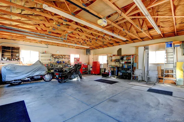 a view of a garage with a bike and wooden roof