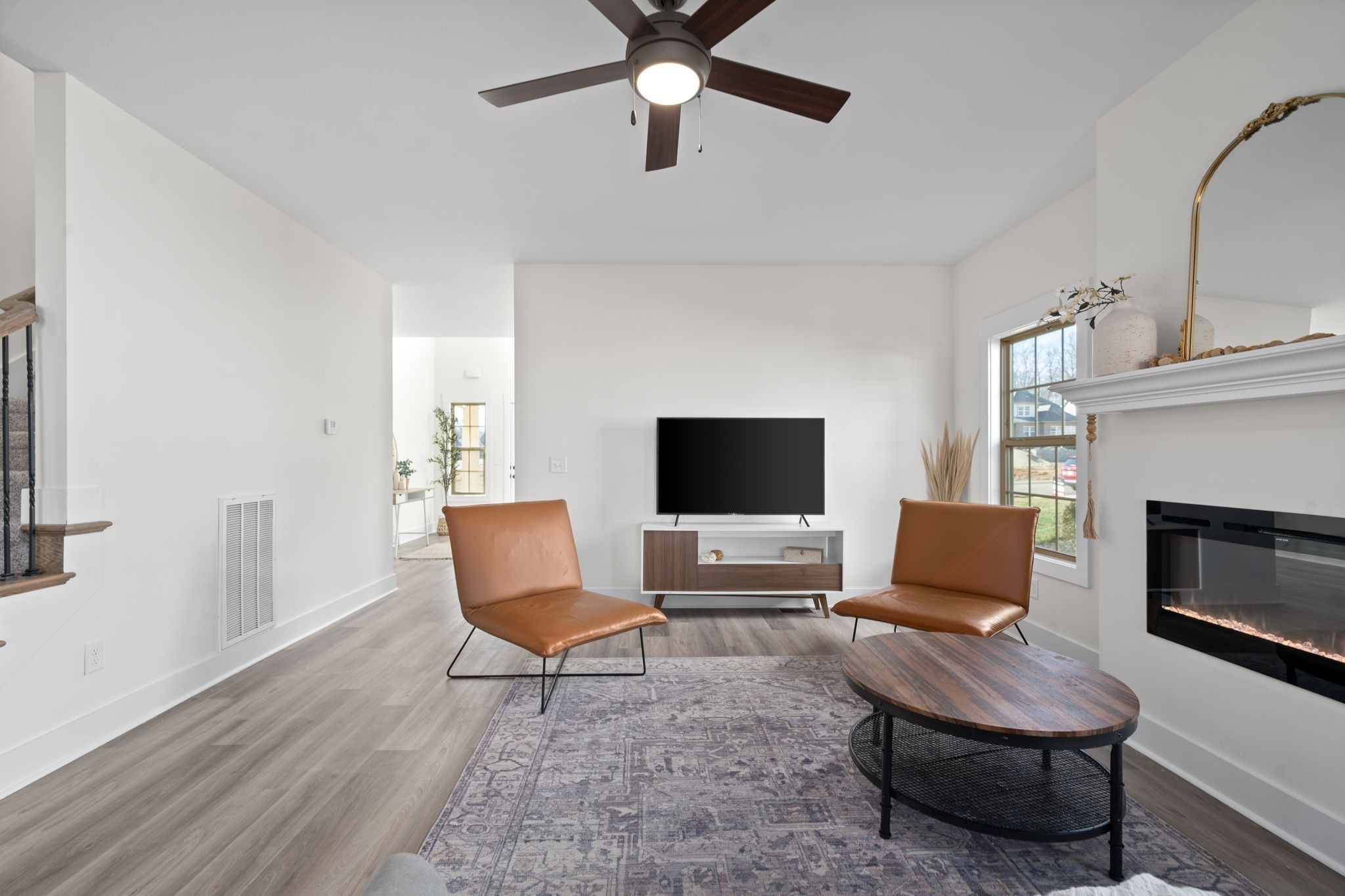 189 Dewberry Road Clarksville, TN 37042 - Photo 11 of 52 a living room with furniture a fireplace and a flat screen tv