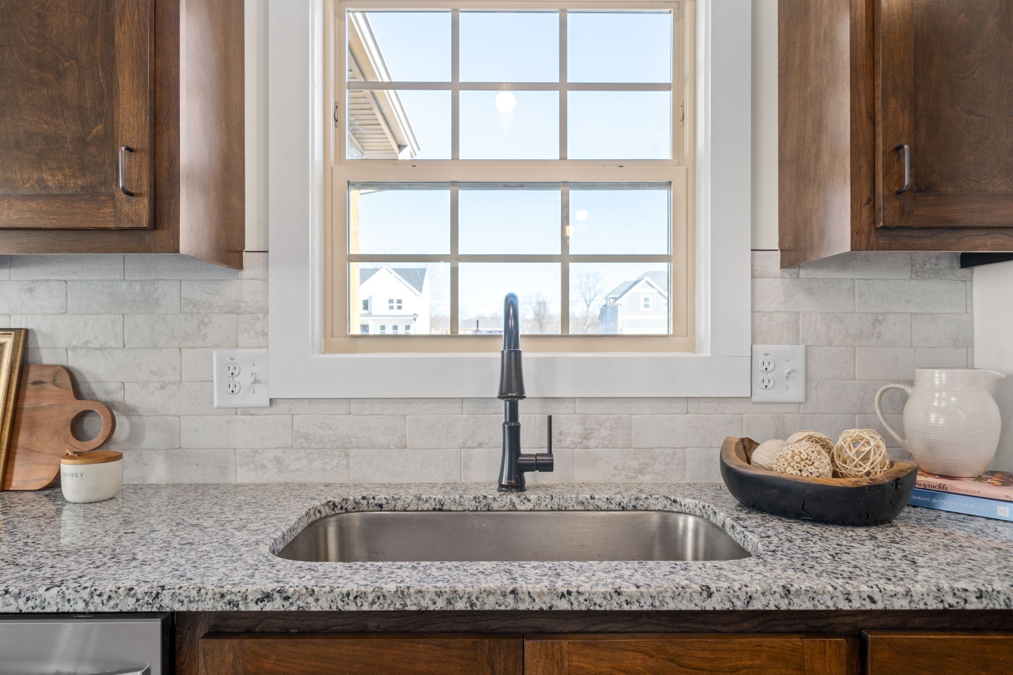 189 Dewberry Road Clarksville, TN 37042 - Photo 20 of 52 a kitchen with granite countertop wooden cabinets and a sink