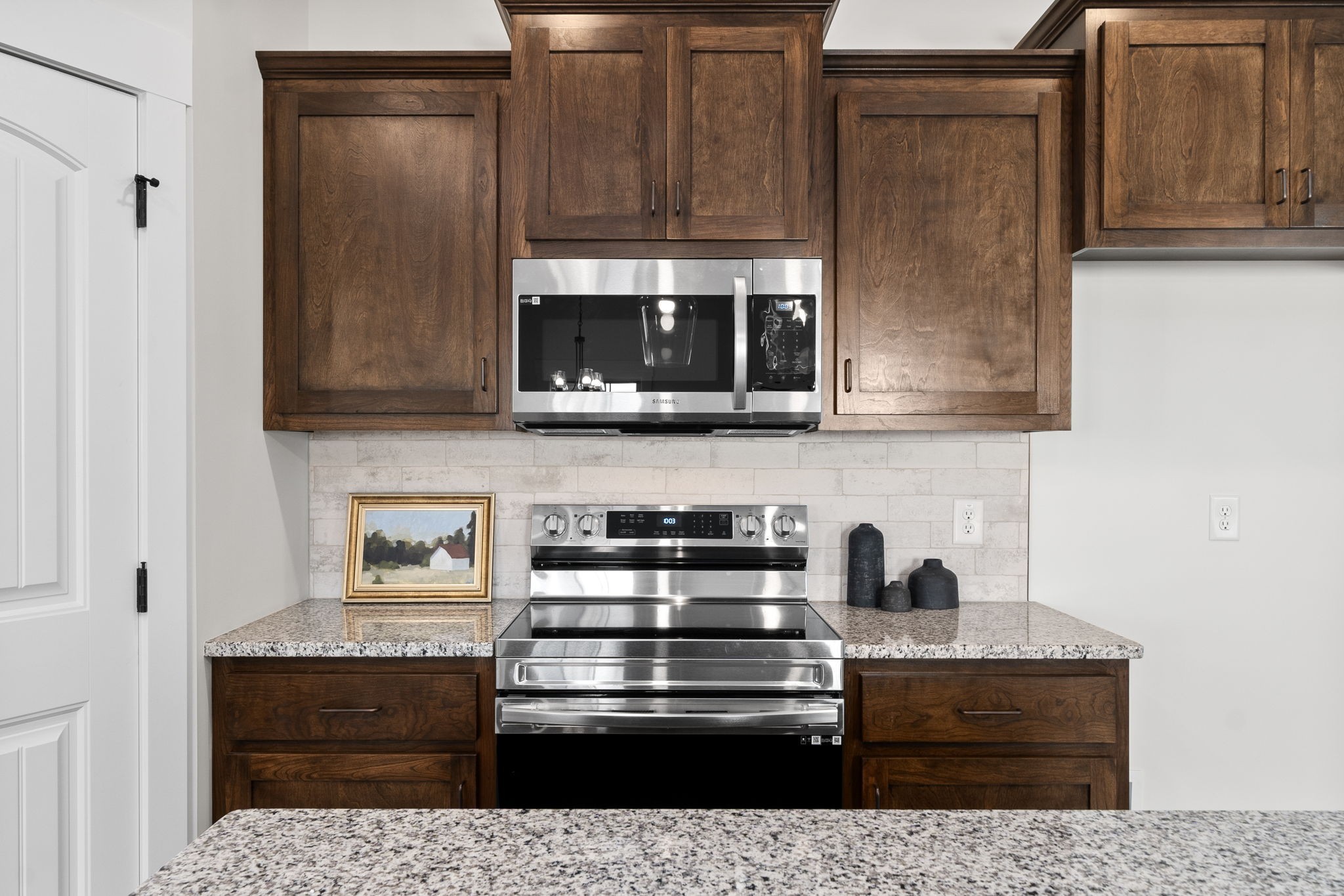 189 Dewberry Road Clarksville, TN 37042 - Photo 23 of 52 a kitchen with stainless steel appliances granite countertop a stove and a microwave