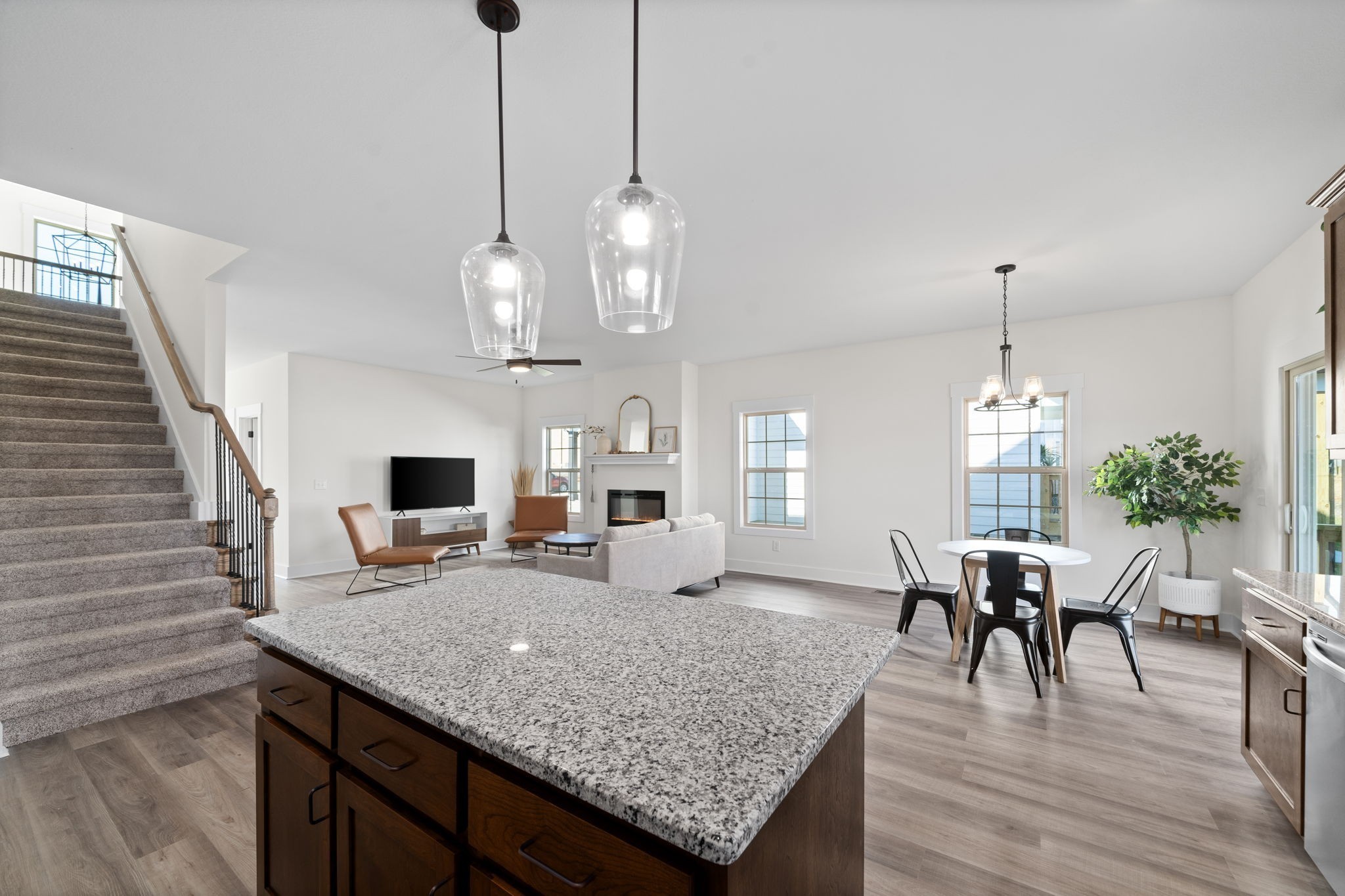 189 Dewberry Road Clarksville, TN 37042 - Photo 24 of 52 a view of a dining room and livingroom with furniture wooden floor a chandelier