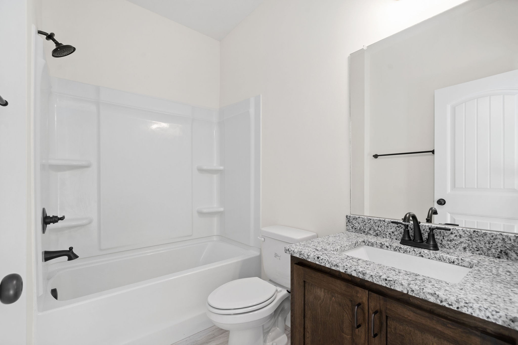 189 Dewberry Road Clarksville, TN 37042 - Photo 27 of 52 a bathroom with a granite countertop sink a toilet and bathtub