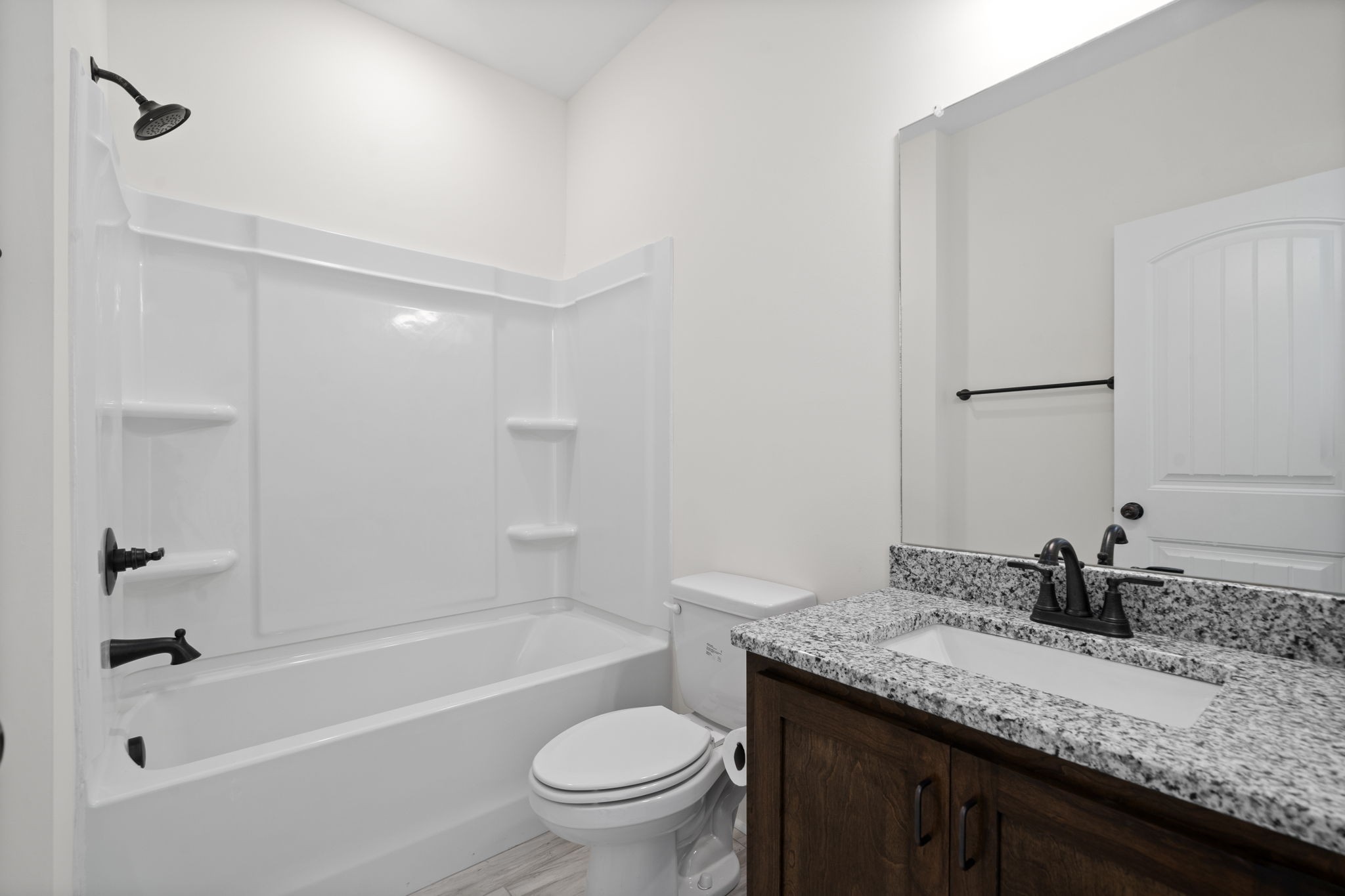 189 Dewberry Road Clarksville, TN 37042 - Photo 40 of 52 a bathroom with a granite countertop sink a toilet and bathtub