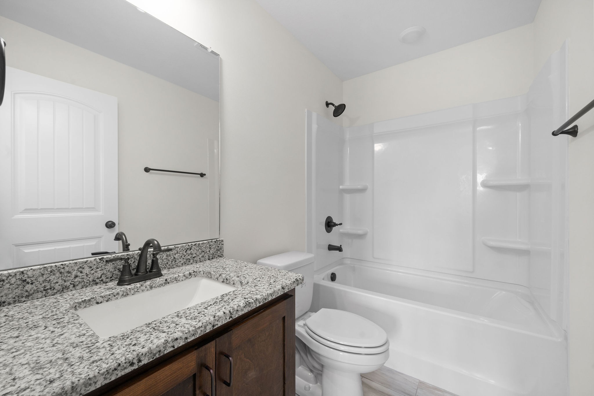 189 Dewberry Road Clarksville, TN 37042 - Photo 41 of 52 a bathroom with a granite countertop sink a toilet and bathtub