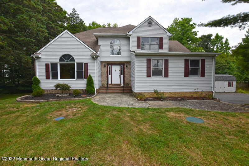 84 Daum Road Manalapan, NJ 07726 - Photo 1 of 50 a front view of a house with a yard