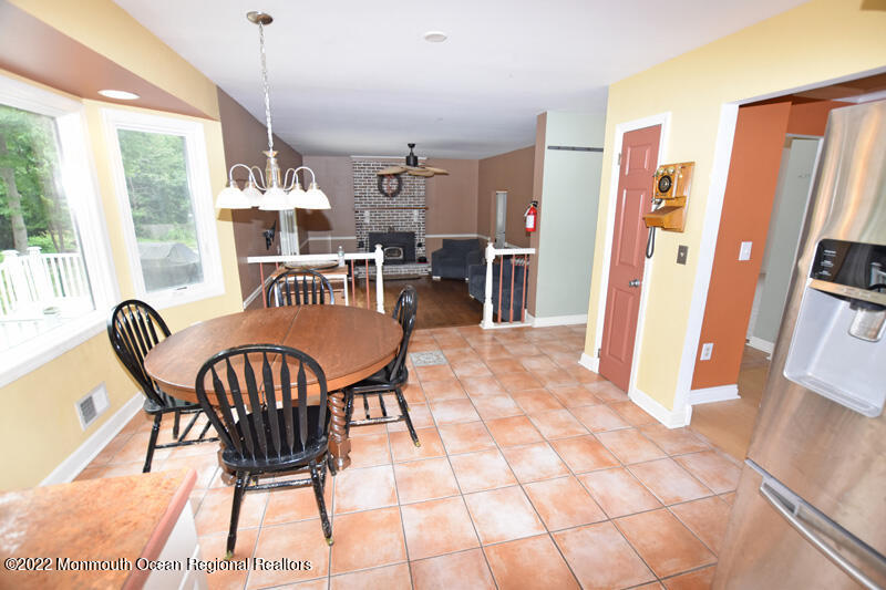 84 Daum Road Manalapan, NJ 07726 - Photo 18 of 50 a view of a dining room with furniture window and outside view