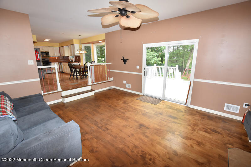 84 Daum Road Manalapan, NJ 07726 - Photo 21 of 50 a living room with furniture and a large window