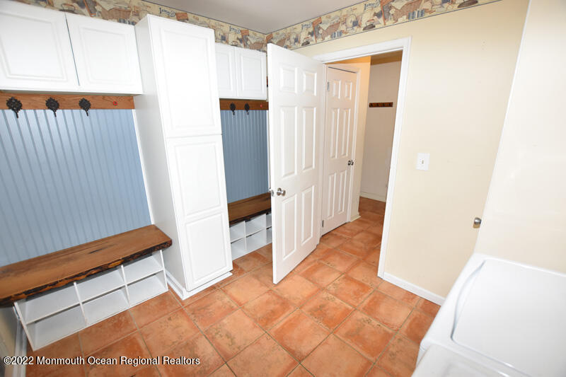 84 Daum Road Manalapan, NJ 07726 - Photo 24 of 50 a view of a hallway with white walls and stairs