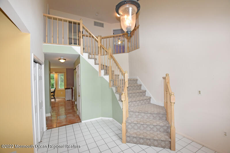 84 Daum Road Manalapan, NJ 07726 - Photo 3 of 50 a view of entryway and hall with wooden floor