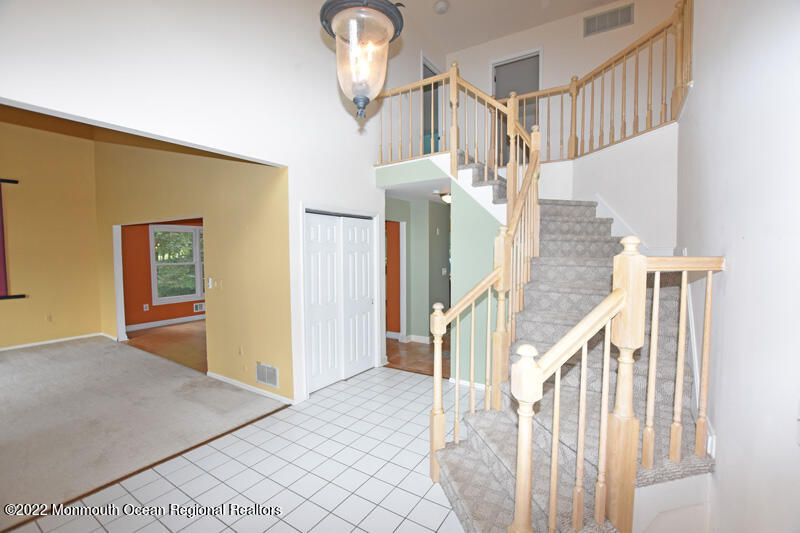 84 Daum Road Manalapan, NJ 07726 - Photo 4 of 50 a view of entryway and hall with wooden floor