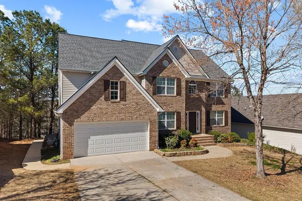 a front view of a house with yard