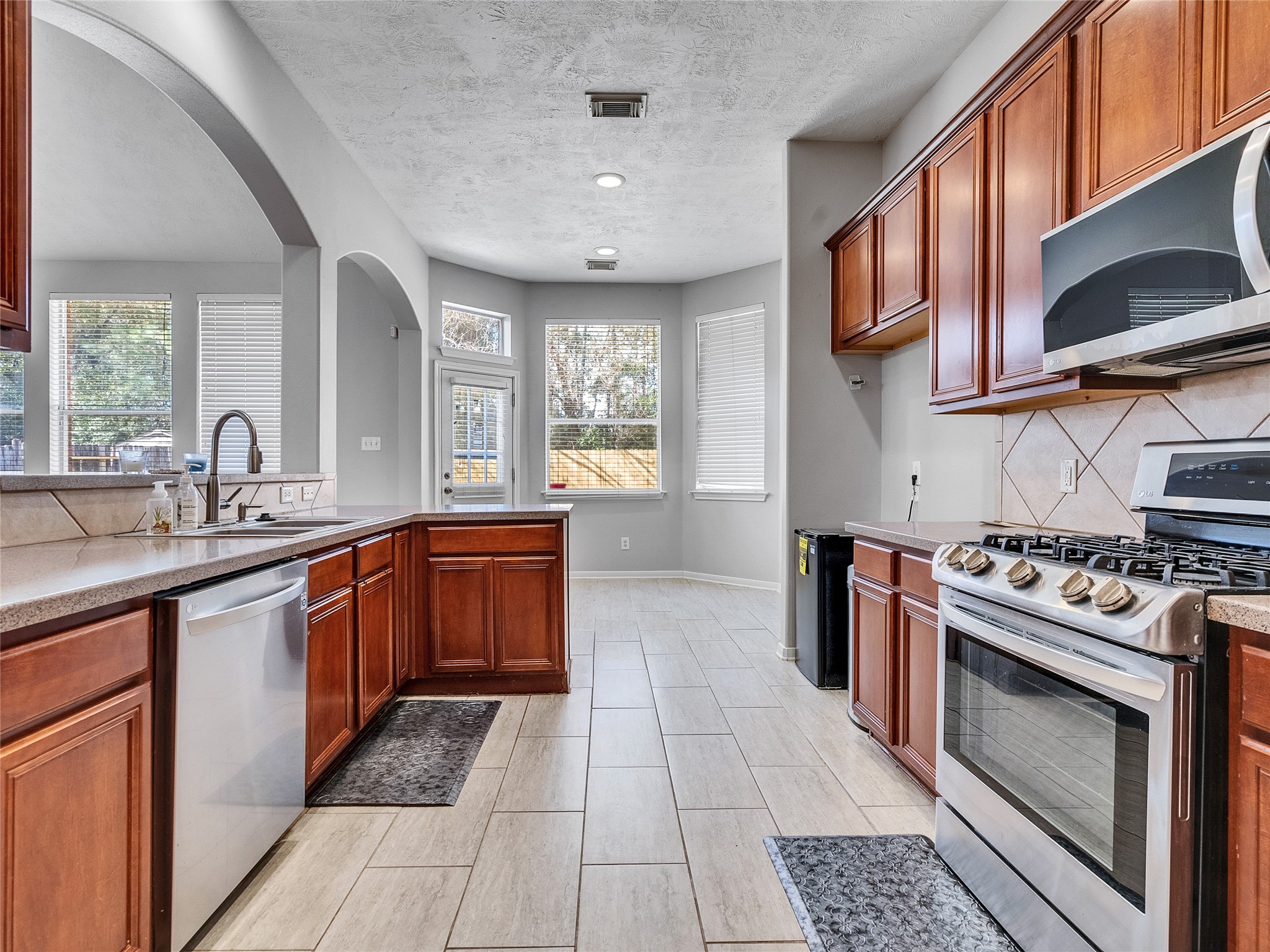 2615 Fern Lacy Drive Spring, TX 77388 - Photo 14 of 33 Here's a view of the stainless steel appliances, including a gas range that provides to energy to cook up some gourmet meals