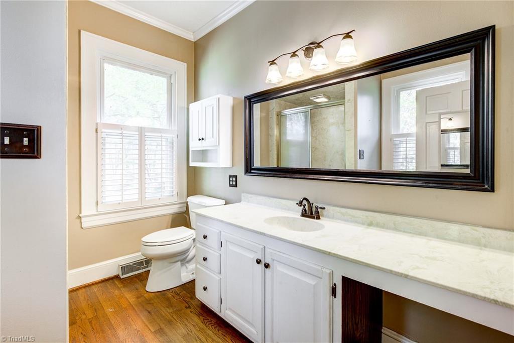 213 Ransom Road Winston-Salem, NC 27106 - Photo 14 of 25 Master Bath with walk in shower and vanity area.