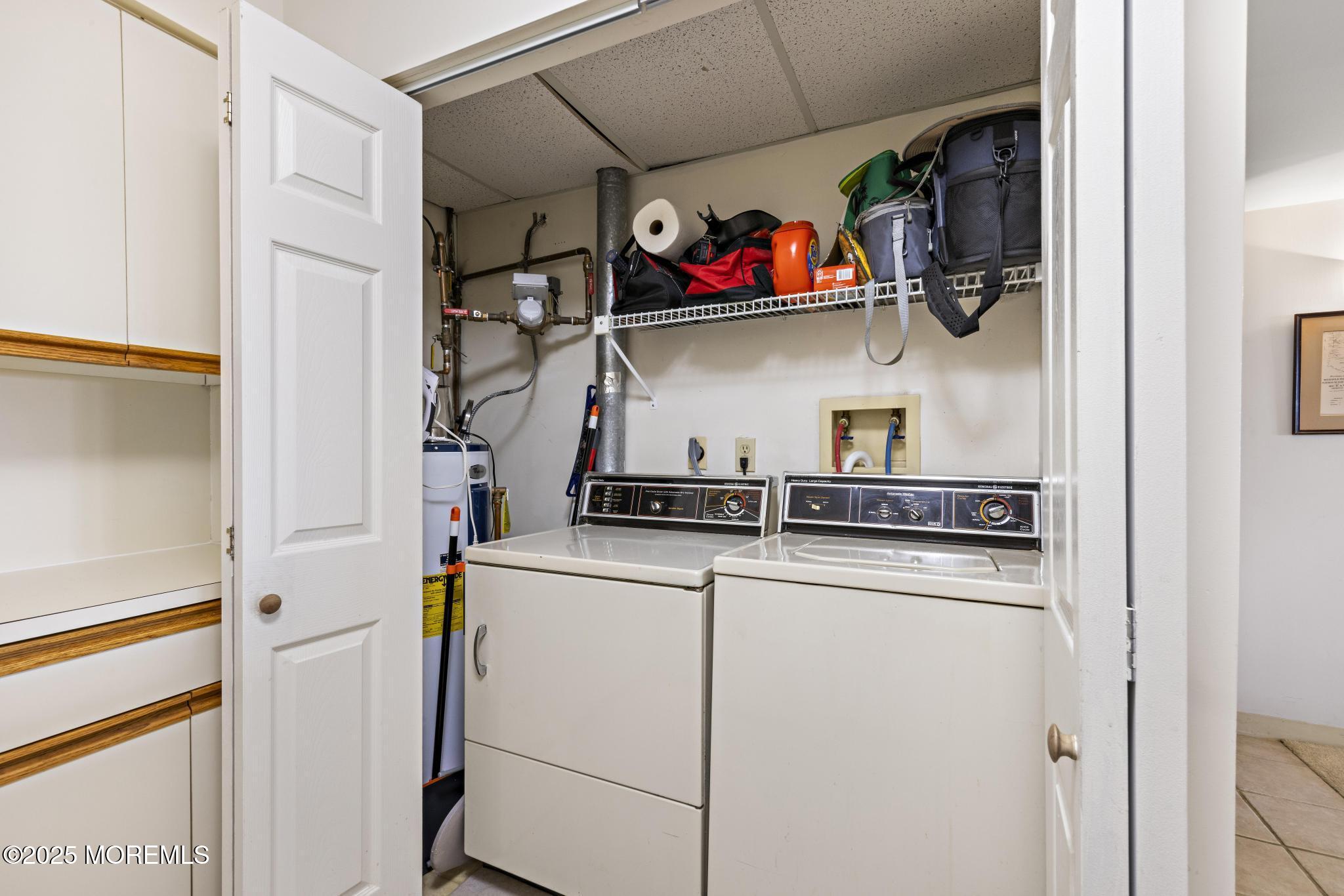 32 Center Avenue, Unit 17 Atlantic Highlands, NJ 07716 - Photo 12 of 27 a utility room with dryer and washer