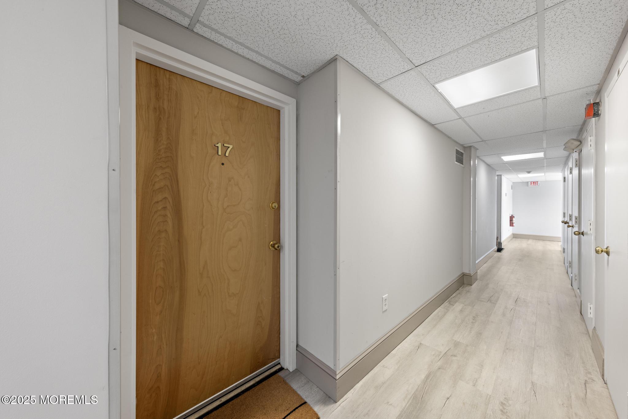 32 Center Avenue, Unit 17 Atlantic Highlands, NJ 07716 - Photo 19 of 27 a view of a hallway with wooden floor
