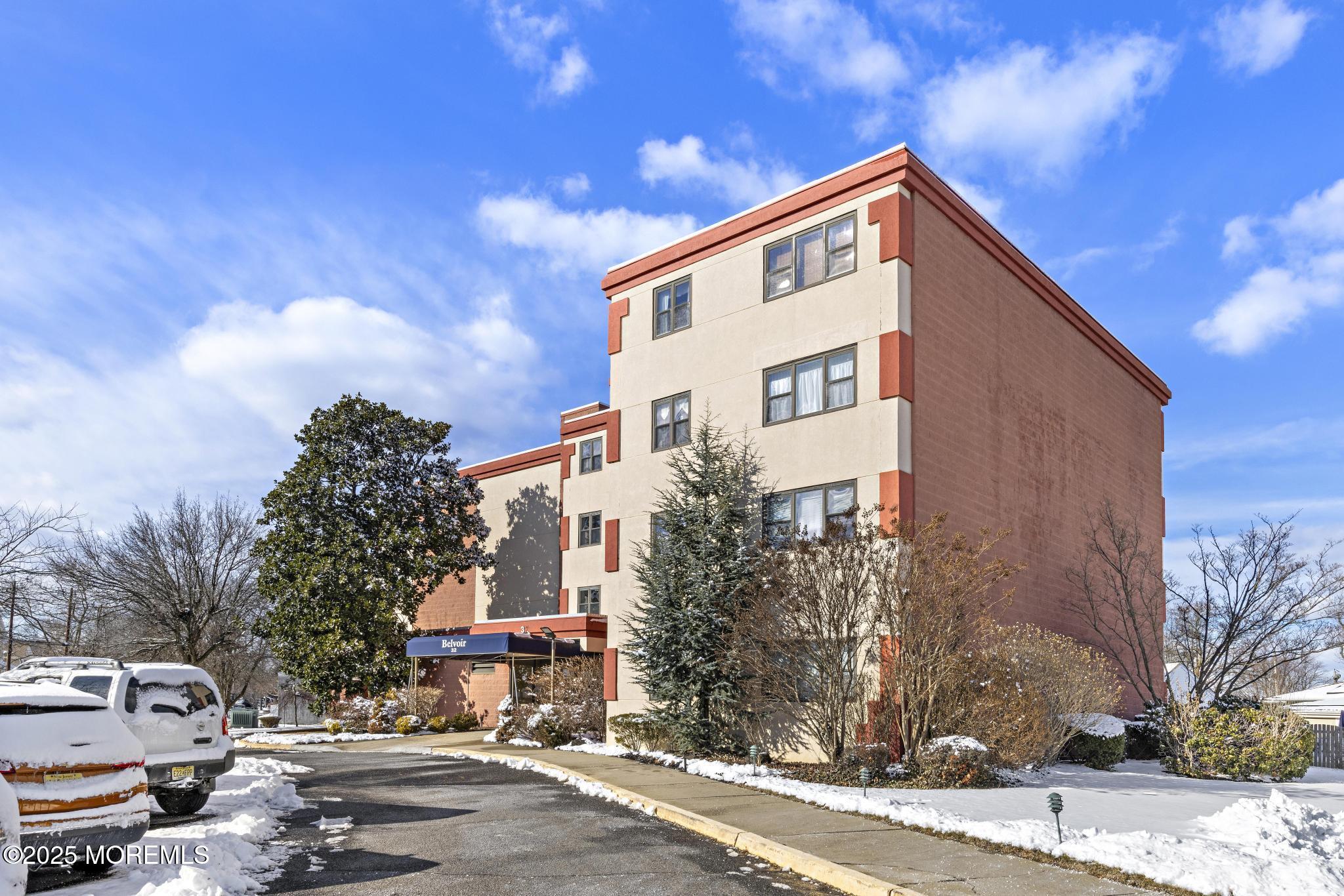 32 Center Avenue, Unit 17 Atlantic Highlands, NJ 07716 - Photo 22 of 27 a front view of a building with street view