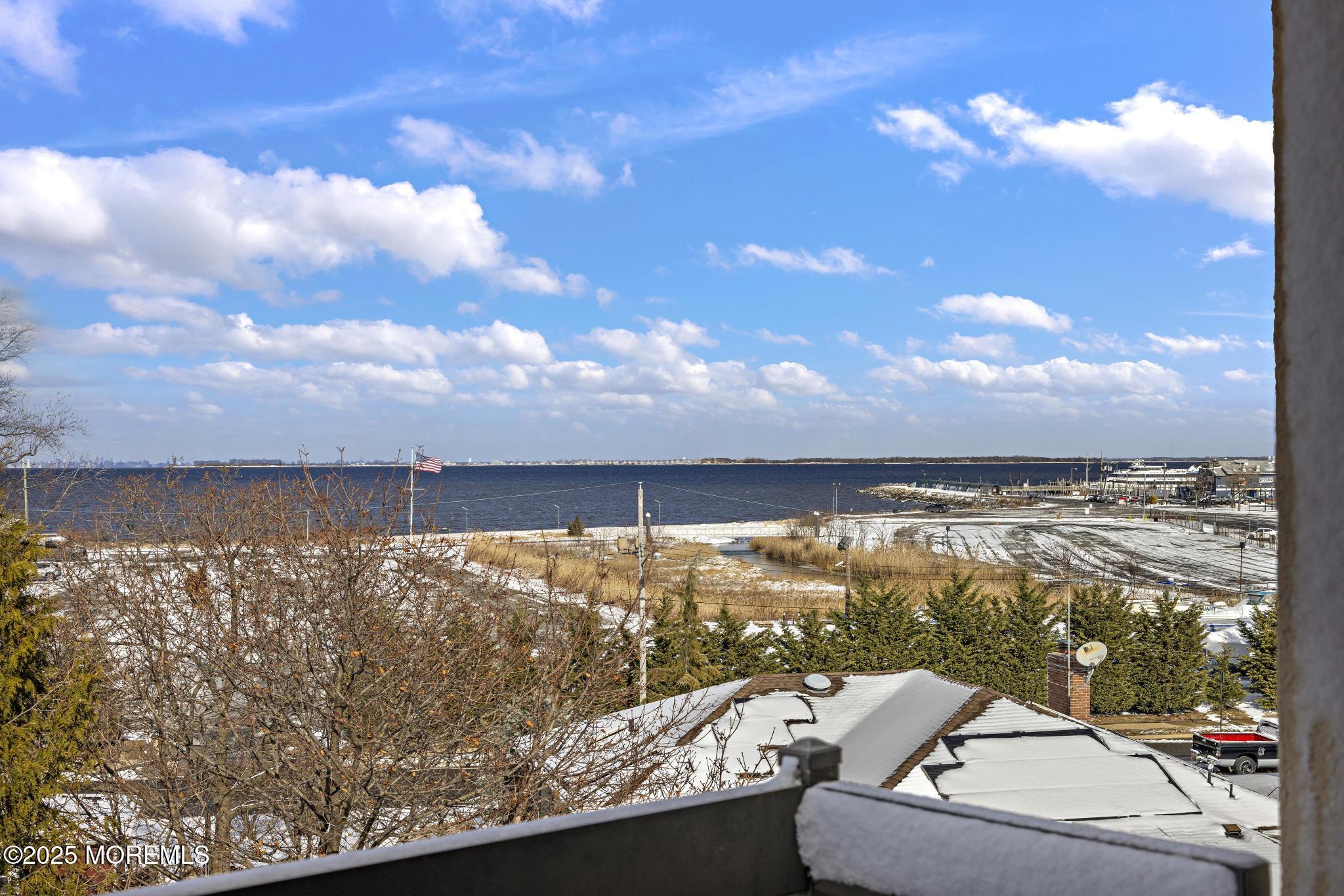 32 Center Avenue, Unit 17 Atlantic Highlands, NJ 07716 - Photo 24 of 27 a view of a lake from a terrace