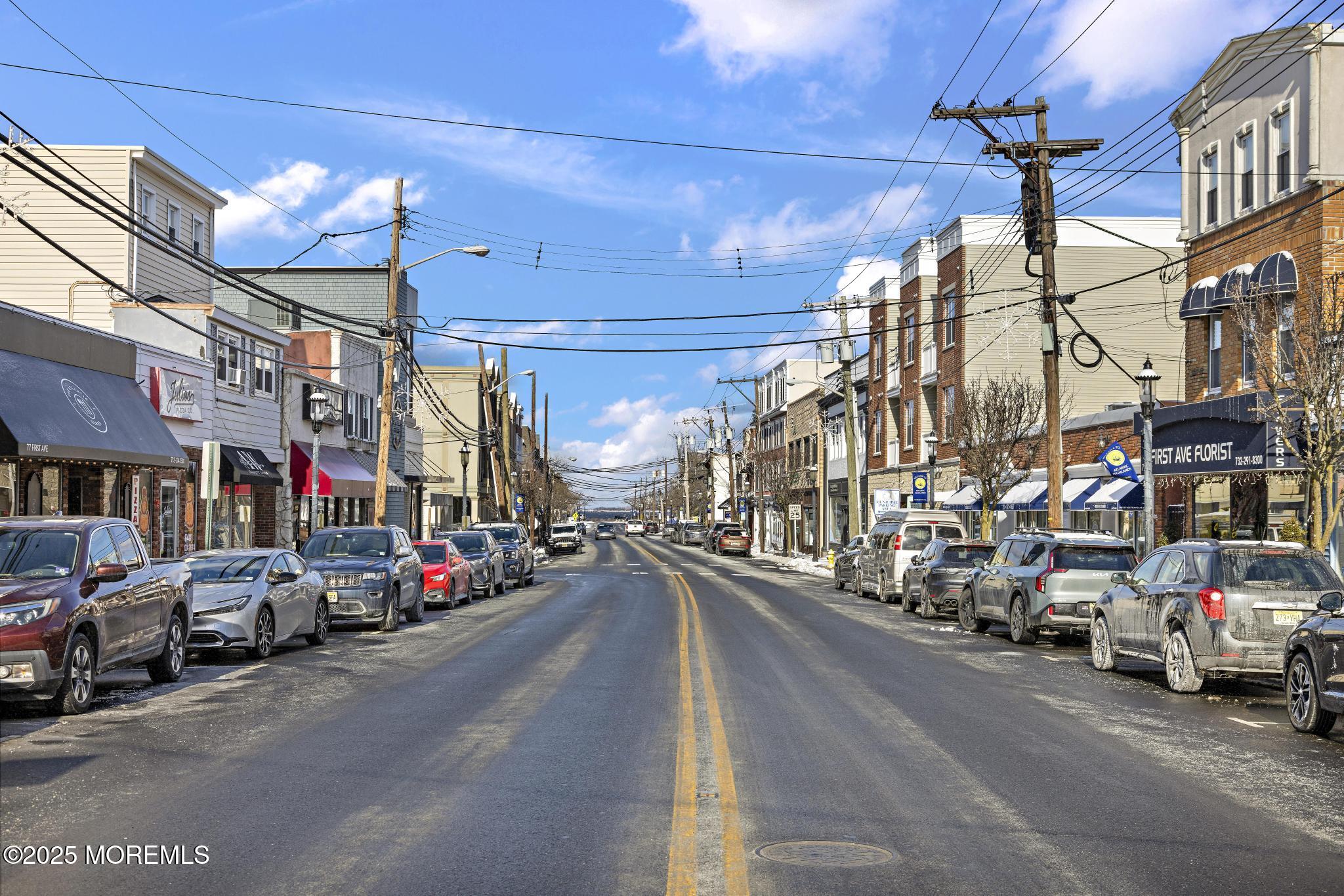 32 Center Avenue, Unit 17 Atlantic Highlands, NJ 07716 - Photo 25 of 27 a view of a street with cars and a cars parked on the road
