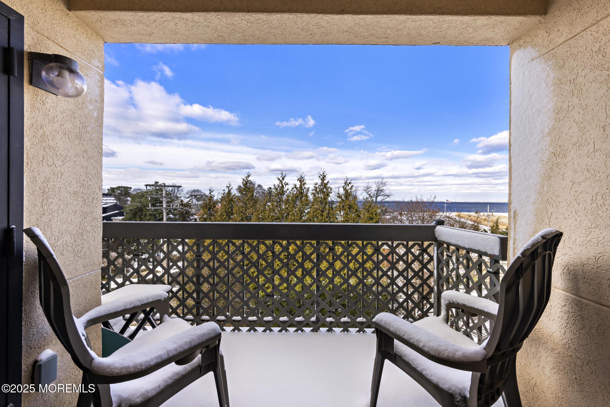 32 Center Avenue, Unit 17 Atlantic Highlands, NJ 07716 - Photo 5 of 27 a view of a balcony with chair