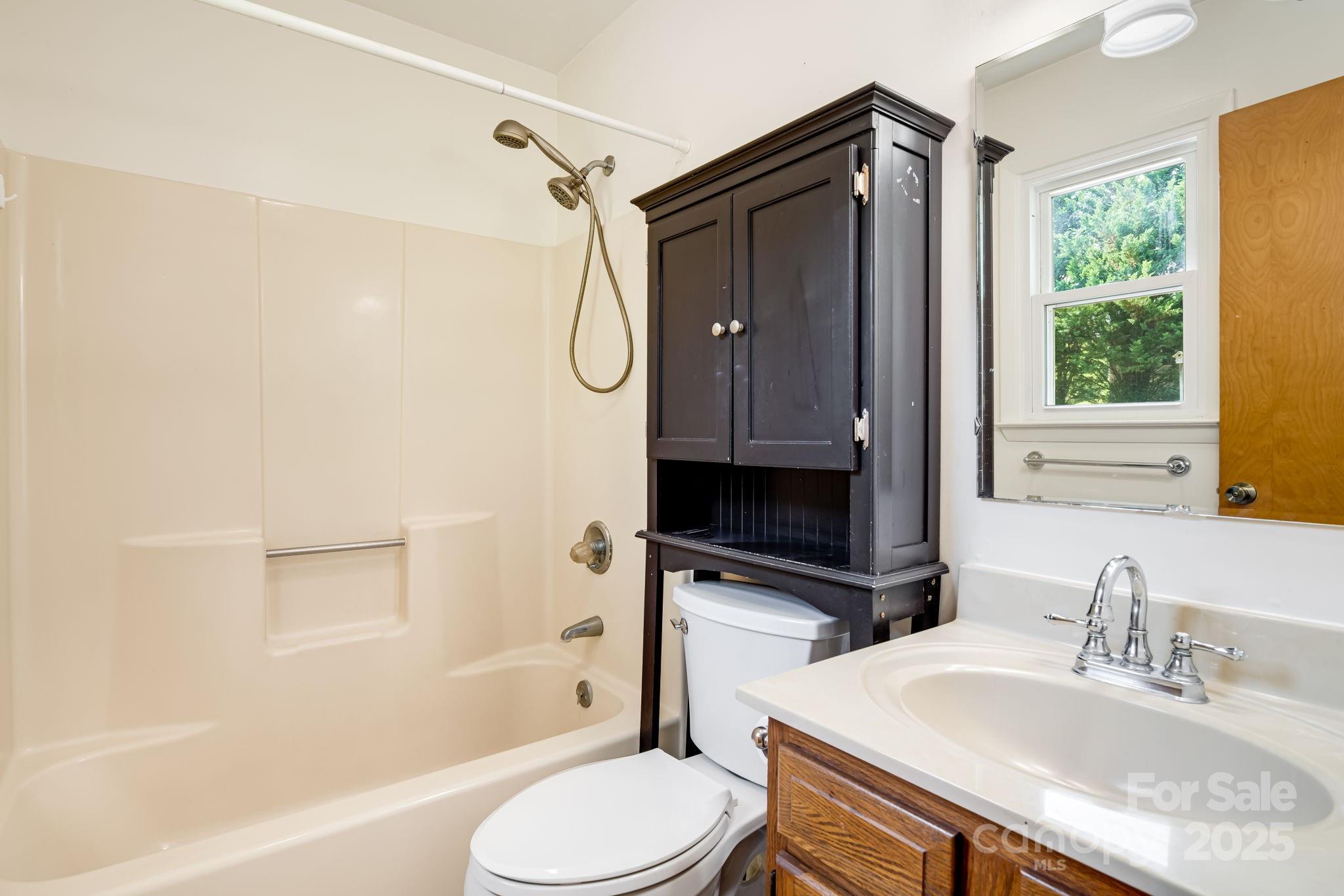 1360 Jupiter Road Weaverville, NC 28787 - Photo 13 of 39 a bathroom with a sink toilet and shower