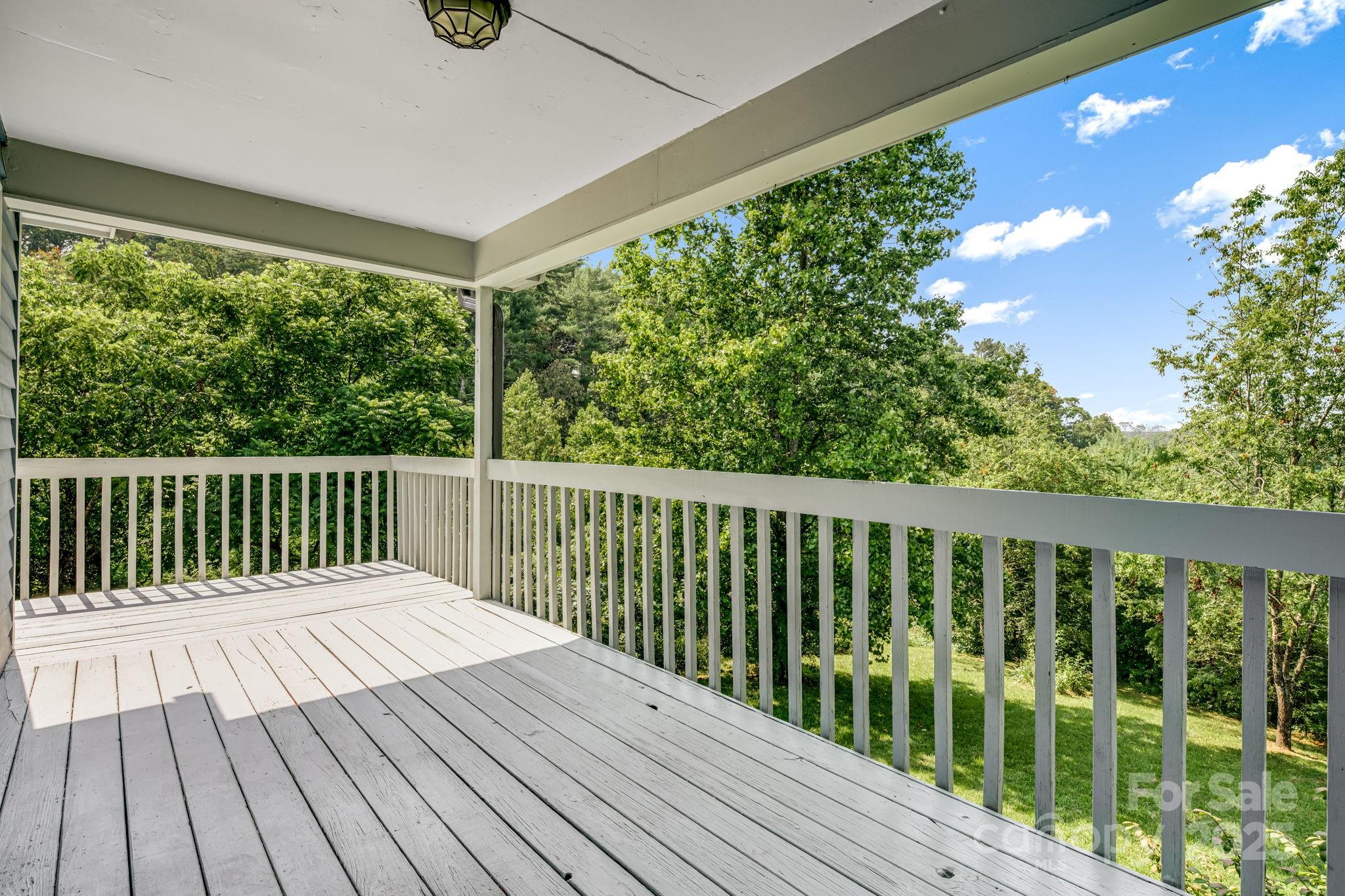 1360 Jupiter Road Weaverville, NC 28787 - Photo 17 of 39 a balcony with wooden floor and fence