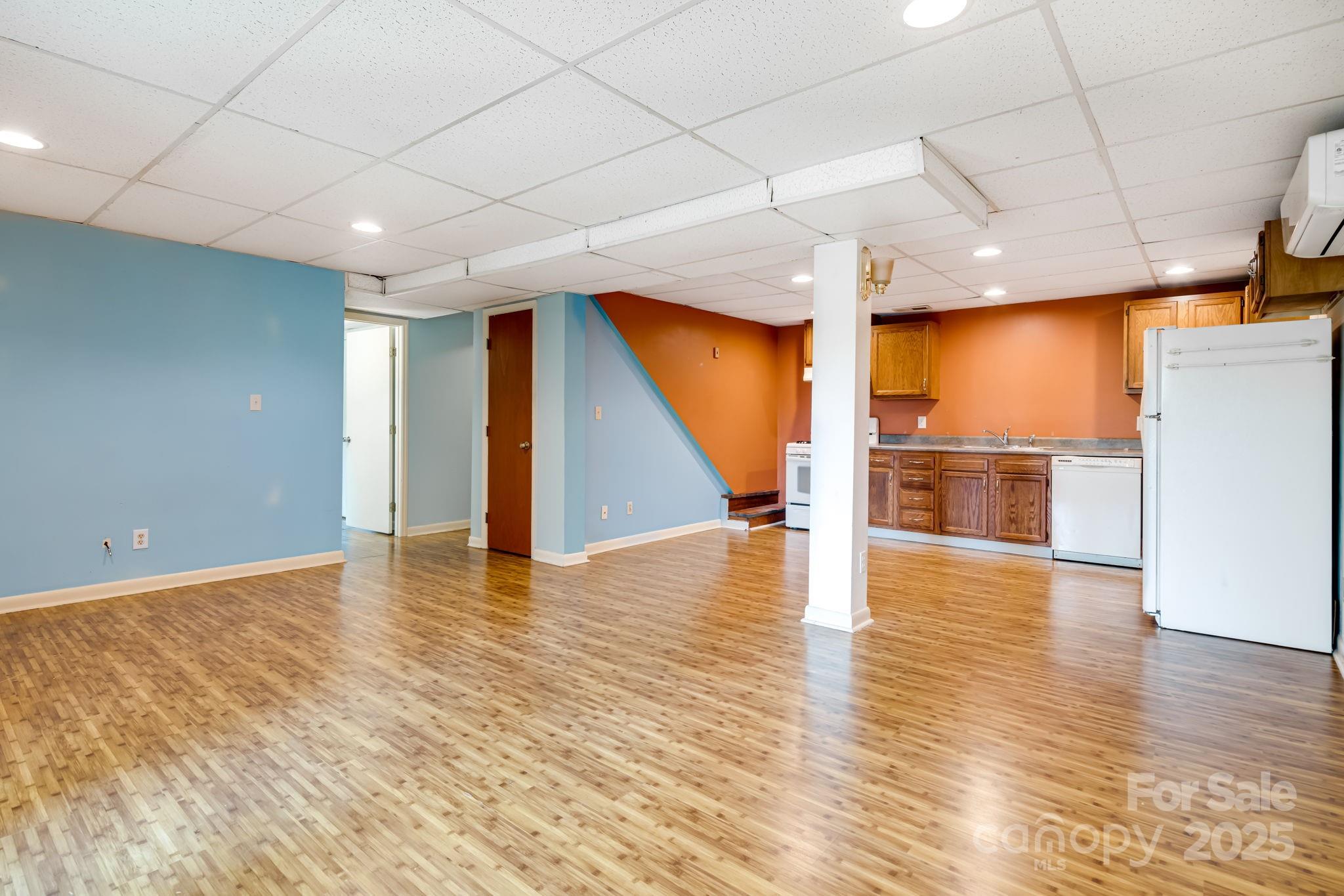 1360 Jupiter Road Weaverville, NC 28787 - Photo 20 of 39 a view of an empty room with wooden floor