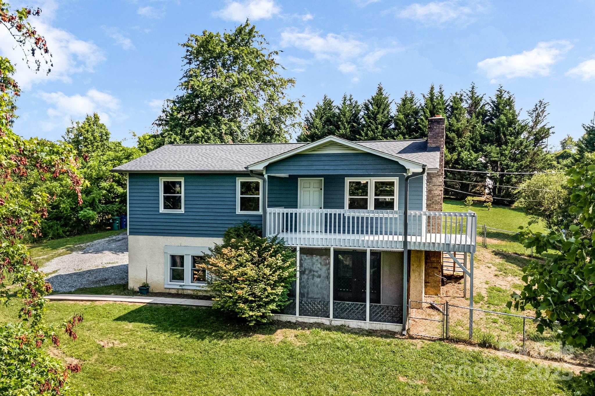 1360 Jupiter Road Weaverville, NC 28787 - Photo 29 of 39 a front view of a house with a garden