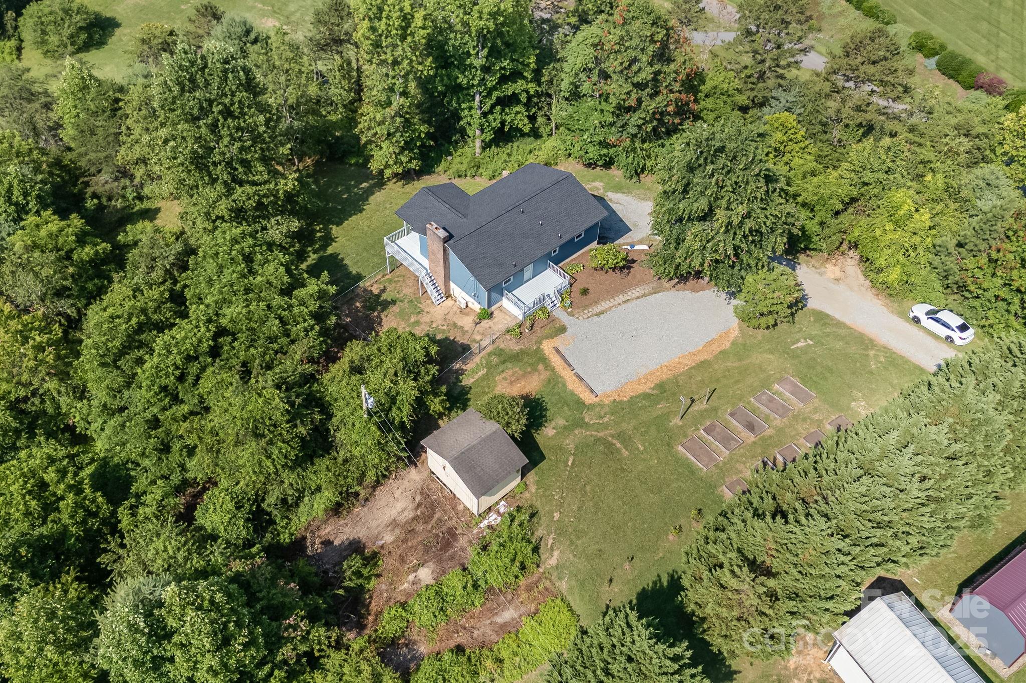 1360 Jupiter Road Weaverville, NC 28787 - Photo 34 of 39 an aerial view of a house with a garden