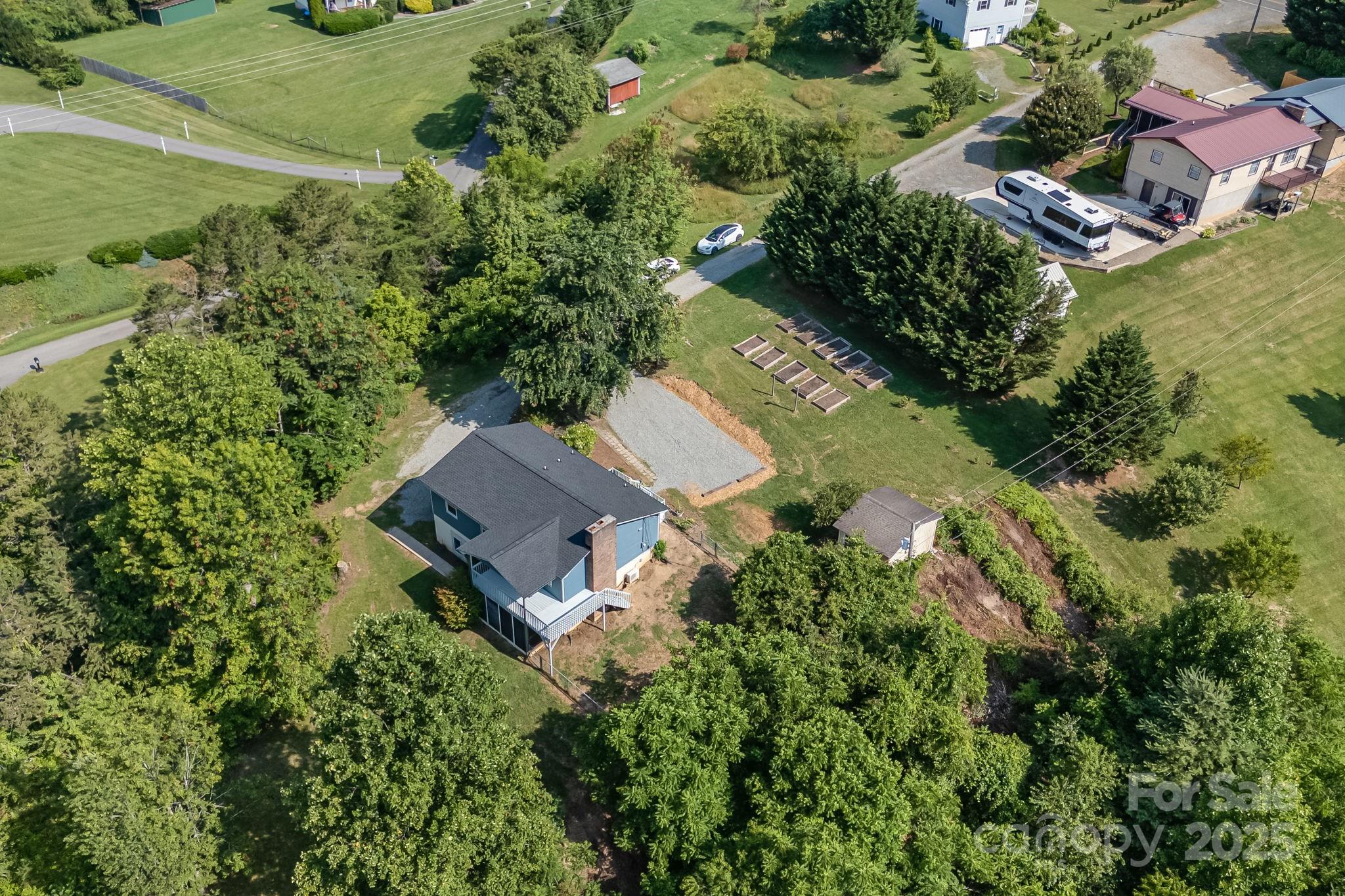 1360 Jupiter Road Weaverville, NC 28787 - Photo 35 of 39 an aerial view of a house with a garden