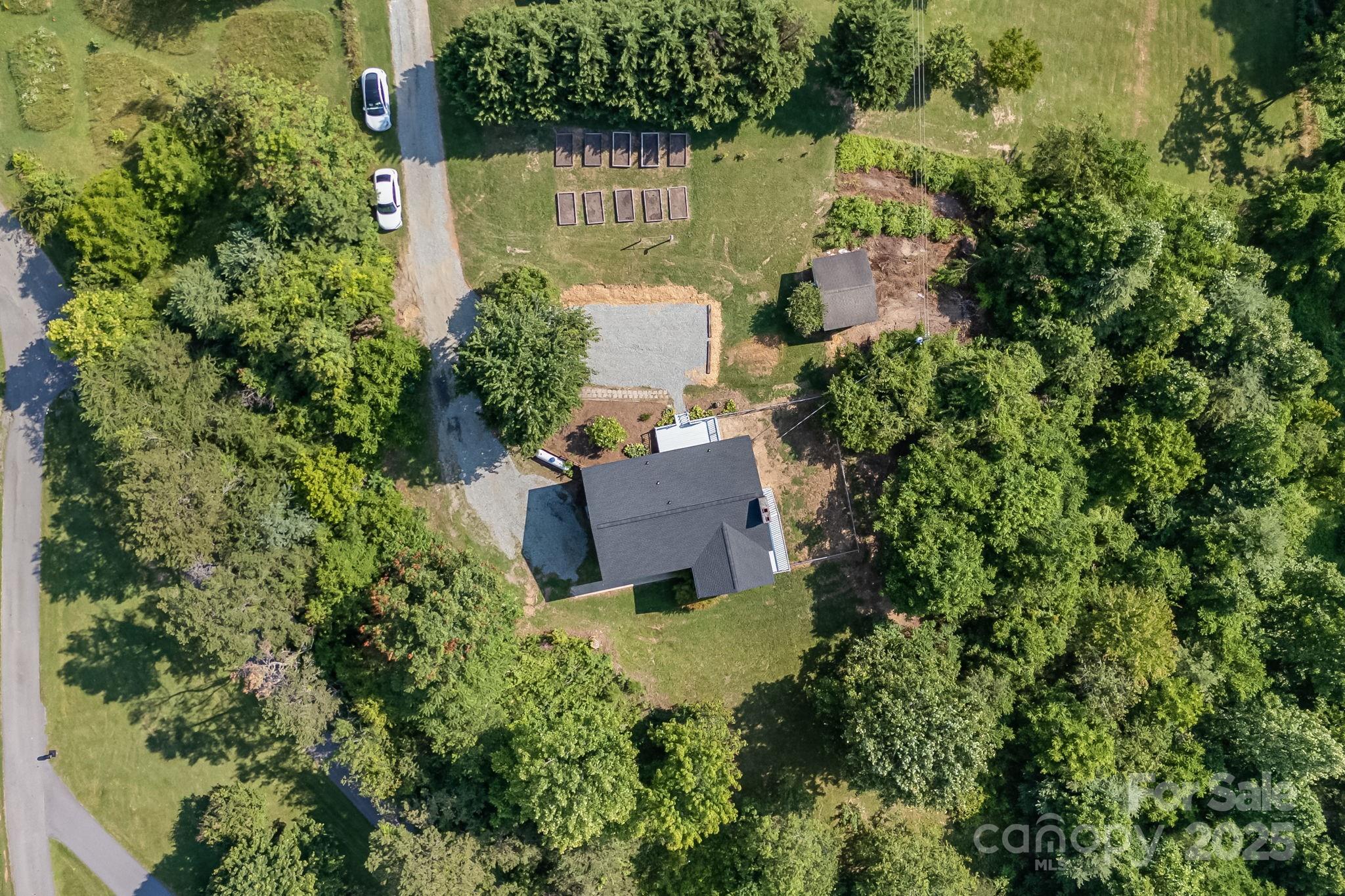 1360 Jupiter Road Weaverville, NC 28787 - Photo 36 of 39 an aerial view of house with yard and outdoor seating