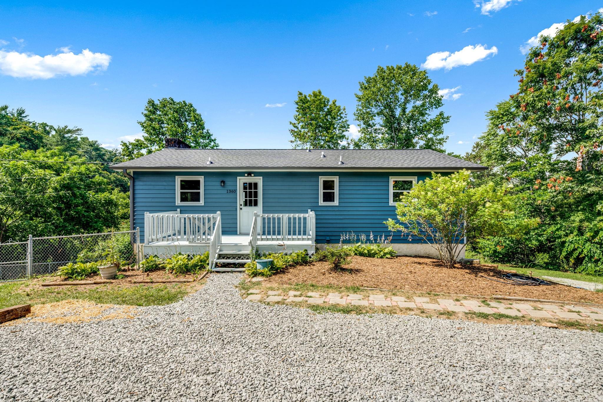 1360 Jupiter Road Weaverville, NC 28787 - Photo 5 of 39 a front view of a house with garden